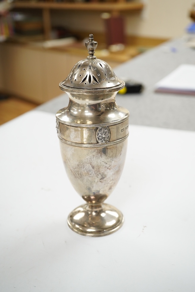 A George V silver sugar caster, by Harrod's Ltd, Sheffield, 1912, 18.4cm and a pair of Victorian commemorative spoons, Edward Pairpoint, London, 1878. Condition - fair to good.